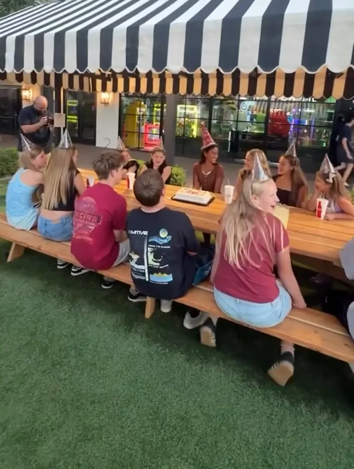 Eating together during a day of indoor family fun near Phoenix at Pecan Lake Entertainment A birthday group gathered for cake, part of what makes Pecan Lake one of the party places Arizona families choose near Chandler